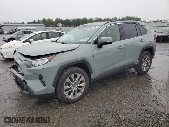 2021 Toyota RAV4 XLE Premium with VIN JTMA1RFV0MD074834, listed as a Copart auction lot 58466965 with 71,623 mi miles and Salvage title. Bid and sale history available at DreamBid. Image 1.