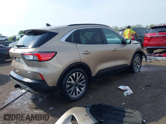 2020 Ford Escape Titanium z VIN 1FMCU9J92LUB48243, wystawiony jako IAAI lot #42143038 z przebiegiem 63 172 mil mil oraz . Historia ofert i sprzedaży dostępna na DreamBid. Obrazek 4.