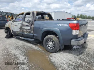 2010 Toyota Tundra с VIN 5TFUM5F15AX005061, выставлен на аукционе Copart как лот 51823565 с пробегом Не указан миль и Списание • Salvage title. История ставок и продаж доступна на DreamBid. Изображение 2.