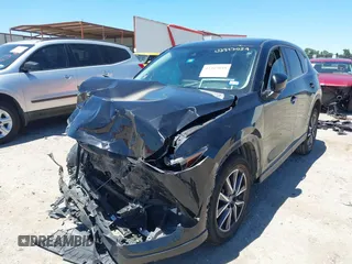 2018 Mazda CX-5 Touring z VIN JM3KFACM3J1339074, wystawiony jako IAAI lot #42317039 z przebiegiem 82 799 mil mil oraz . Historia ofert i sprzedaży dostępna na DreamBid. Obrazek 18.