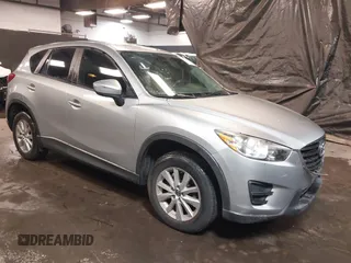 2016 Mazda CX-5 Sport with VIN JM3KE4BY6G0815289, listed as a IAAI auction lot 41331310 with 118,323 mi miles and . Bid and sale history available at DreamBid. Image 1.
