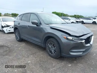 2021 Mazda CX-5 Touring with VIN JM3KFACM1M0461510, listed as a IAAI auction lot 41660439 with 30,352 mi miles. Bid and sale history available at carsss.com. Image 1.