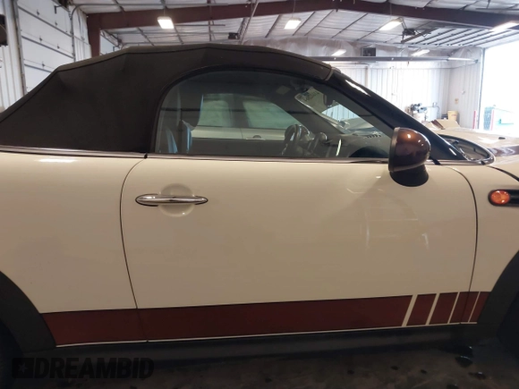 2013 MINI Roadster with VIN WMWSY1C52DT625564, listed as a IAAI auction lot 41442864 with 98,240 mi miles and . Bid and sale history available at DreamBid. Image 14.