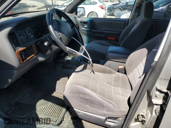 1998 Jeep Grand Cherokee Laredo z VIN 1J4GZ58S4WC278490, wystawiony jako Copart lot #62388535 z przebiegiem 133 896 mil mil oraz Czysty tytuł • Clean title. Historia ofert i sprzedaży dostępna na DreamBid. Obrazek 7.