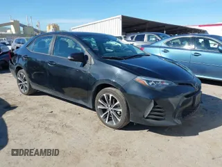 2019 Toyota Corolla L z VIN 5YFBURHE7KP857880, wystawiony jako IAAI lot #41850987 z przebiegiem 117 823 mil mil oraz . Historia ofert i sprzedaży dostępna na DreamBid. Obrazek 1.