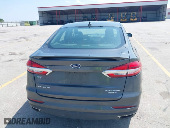 2020 Ford Fusion Titanium with VIN 3FA6P0D9XLR131042, listed as a IAAI auction lot 42560444 with 95,351 mi miles and . Bid and sale history available at DreamBid. Image 16.