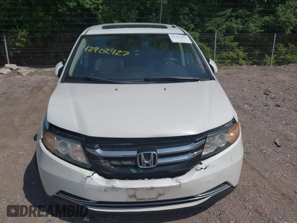 2014 Honda Odyssey EX-L with VIN 5FNRL5H63EB131596, listed as a IAAI auction lot 42402427 with 106,156 mi miles and . Bid and sale history available at DreamBid. Image 6.