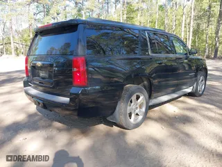 2015 Chevrolet Suburban LT with VIN 1GNSKJKC0FR238524, listed as a IAAI auction lot 42046889 with 179,676 mi miles. Bid and sale history available at carsss.com. Image 4.