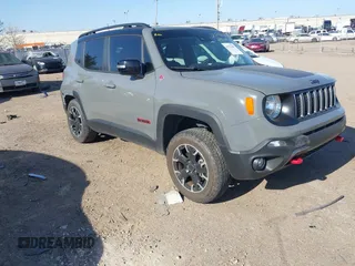 2023 Jeep Renegade Trailhawk z VIN ZACNJDC19PPP27959, wystawiony jako IAAI lot #41771299 z przebiegiem 14 839 mil mil oraz . Historia ofert i sprzedaży dostępna na DreamBid. Obrazek 1.