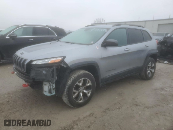 2014 Jeep Cherokee Trailhawk with VIN 1C4PJMBS1EW240177, listed as a Copart auction lot 43321715 with 212,339 mi miles and Salvage title. Bid and sale history available at DreamBid. Image 1.