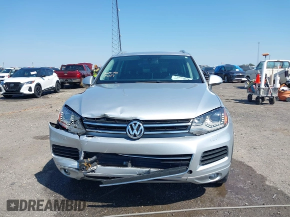 2014 Volkswagen Touareg Sport with VIN WVGEF9BP6ED007436, listed as a IAAI auction lot 41953307 with 114,925 mi miles and . Bid and sale history available at DreamBid. Image 12.