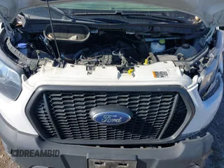 2022 Ford Transit Cargo with VIN 1FTYE1YG3NKA77243, listed as a IAAI auction lot 41231977 with 55,300 mi miles and . Bid and sale history available at DreamBid. Image 10.
