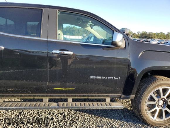 2021 GMC Canyon 2WD Denali with VIN 1GTG5EEN2M1107052, listed as a Copart auction lot 76377704 with 11,696 mi miles and Salvage Title. Bid and sale history available at carsss.com. Image 12.