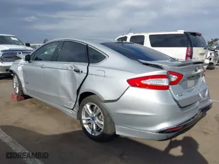 2016 Ford Fusion Energi Titanium with VIN 3FA6P0SU6GR144898, listed as a IAAI auction lot 41912557 with 173,415 mi miles. Bid and sale history available at carsss.com. Image 3.