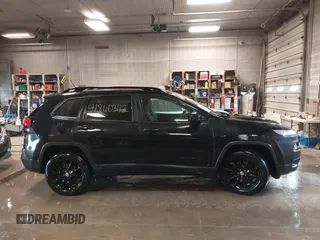 2014 Jeep Cherokee Latitude with VIN 1C4PJMCS0EW291135, listed as a IAAI auction lot 41860372 with 171,524 mi miles and . Bid and sale history available at DreamBid. Image 13.