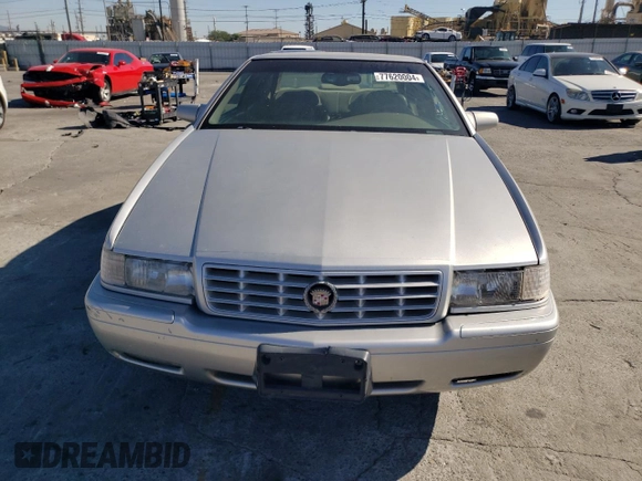 1999 Cadillac Eldorado z VIN 1G6EL12Y0XU604529, wystawiony jako Copart lot #77620004 z przebiegiem 246 032 mil mil oraz Szkoda całkowita • Salvage title. Historia ofert i sprzedaży dostępna na DreamBid. Obrazek 5.