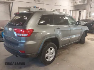 2012 Jeep Grand Cherokee Laredo with VIN 1C4RJFAG3CC209142, listed as a IAAI auction lot 41978296 with 201,796 mi miles. Bid and sale history available at carsss.com. Image 4.