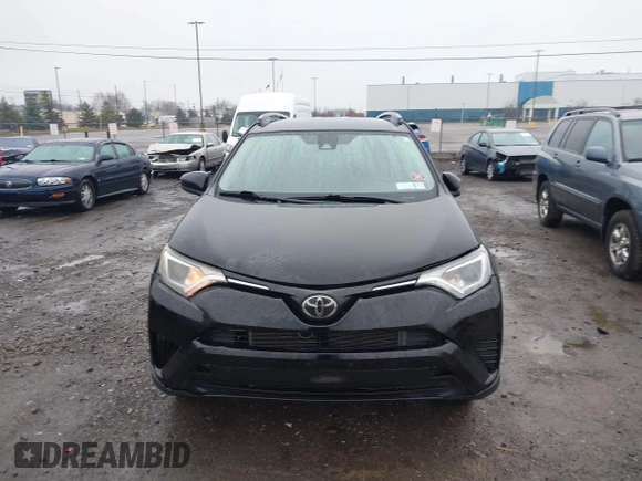 2018 Toyota RAV4 LE with VIN 2T3BFREV2JW788700, listed as a IAAI auction lot 41986212 with 87,704 mi miles. Bid and sale history available at carsss.com. Image 11.