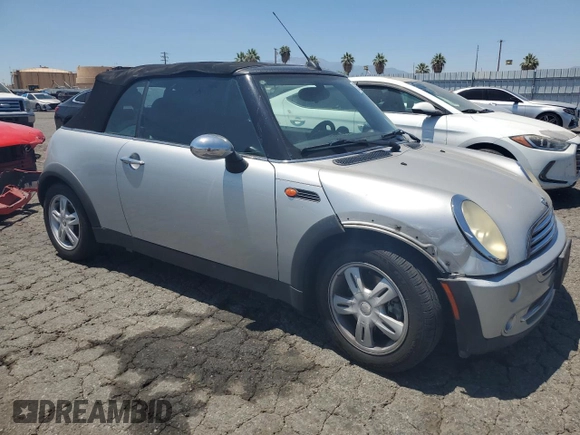 2006 MINI Convertible with VIN WMWRF33576TG16056, listed as a Copart auction lot 63127705 with 108,654 mi miles and Salvage title. Bid and sale history available at DreamBid. Image 4.