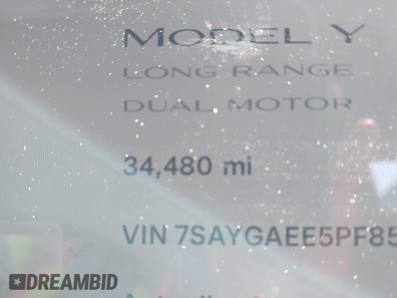 2023 Tesla Model Y Long Range with VIN 7SAYGAEE5PF855834, listed as a IAAI auction lot 41943491 with 34,480 mi miles. Bid and sale history available at carsss.com. Image 16.
