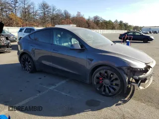 2022 Tesla Model Y Performance z VIN 7SAYGDEF5NF338301, wystawiony jako Copart lot #78189114 z przebiegiem 55 881 mil mil oraz Szkody całkowita. Historia ofert i sprzedaży dostępna na DreamBid. Obrazek 4.
