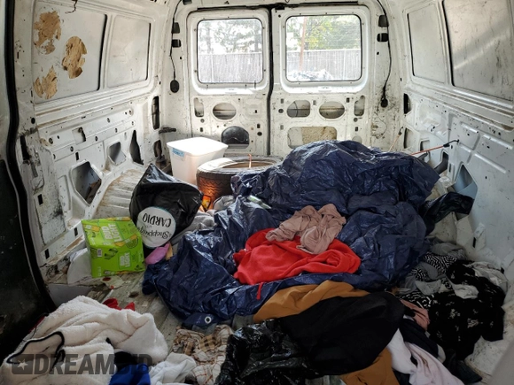 1999 Ford Econoline Cargo with VIN 1FTRE1429XHA29986, listed as a Copart auction lot 70331004 with 312,901 mi miles and Non Repairable. Bid and sale history available at carsss.com. Image 10.