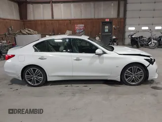 2015 Infiniti Q50 z VIN JN1BV7ARXFM409367, wystawiony jako IAAI lot #41912056 z przebiegiem 126 382 mil mil oraz . Historia ofert i sprzedaży dostępna na DreamBid. Obrazek 13.