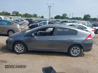 2010 Honda Insight EX with VIN JHMZE2H71AS043465, listed as a IAAI auction lot 42312556 with 151,009 mi miles and . Bid and sale history available at DreamBid. Image 14.
