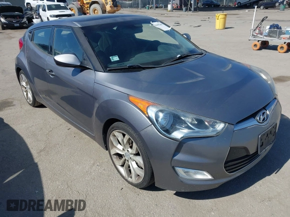 2013 Hyundai Veloster w/Black Int with VIN KMHTC6AD5DU095867, listed as a IAAI auction lot 42698380 with 115,528 mi miles and . Bid and sale history available at DreamBid. Image 1.