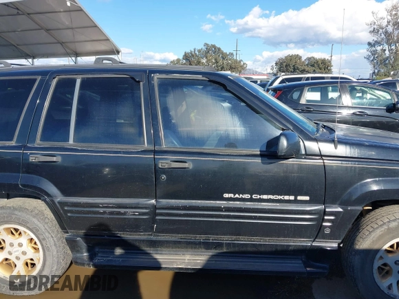 1998 Jeep Grand Cherokee Limited z VIN 1J4GZ78Y3WC105625, wystawiony jako IAAI lot #41742805 z przebiegiem 222 045 mil mil oraz . Historia ofert i sprzedaży dostępna na DreamBid. Obrazek 13.