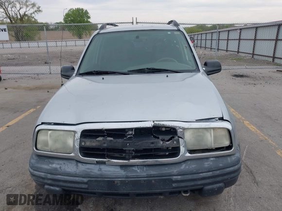 2003 Chevrolet Tracker z VIN 2CNBE134736919970, wystawiony jako IAAI lot #42203446 z przebiegiem 158 872 mil mil oraz . Historia ofert i sprzedaży dostępna na DreamBid. Obrazek 12.
