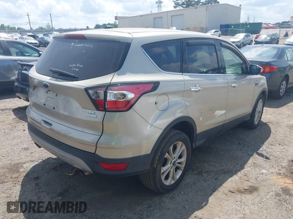 2017 Ford Escape SE with VIN 1FMCU0GD4HUE85348, listed as a IAAI auction lot 42135485 with 124,608 mi miles. Bid and sale history available at carsss.com. Image 4.