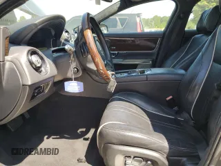 2014 Jaguar XJ Portfolio with VIN SAJWA2GZ2E8V66906, listed as a Copart auction lot 64888135 with 166,194 mi miles and Clean title. Bid and sale history available at DreamBid. Image 7.