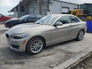 2015 BMW 2 Series 228i with VIN WBA1F5C51FV257605, listed as a Copart auction lot 50991415 with 122,396 mi miles and Salvage Title. Bid and sale history available at carsss.com. Image 1.