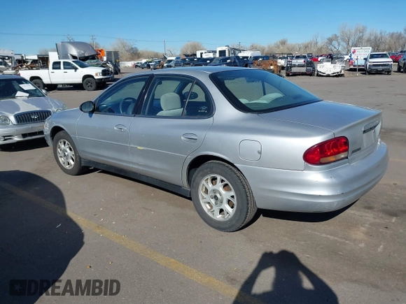 2002 Oldsmobile Intrigue GX z VIN 1G3WH52H02F104930, wystawiony jako IAAI lot #41882923 z przebiegiem 187 601 mil mil oraz . Historia ofert i sprzedaży dostępna na DreamBid. Obrazek 3.
