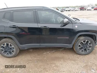 2019 Jeep Compass Trailhawk z VIN 3C4NJDDB5KT618149, wystawiony jako IAAI lot #41959320 z przebiegiem 99 795 mil mil oraz . Historia ofert i sprzedaży dostępna na DreamBid. Obrazek 13.