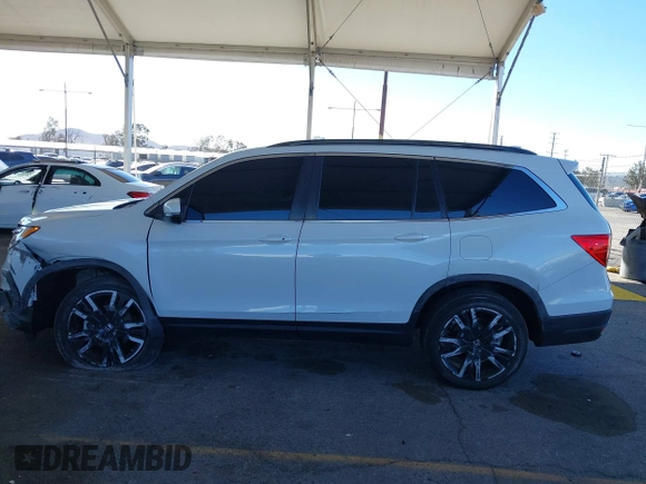 2022 Honda Pilot Special Edition with VIN 5FNYF5H29NB018557, listed as a IAAI auction lot 41402547 with 22,935 mi miles and . Bid and sale history available at carsss.com. Image 14.