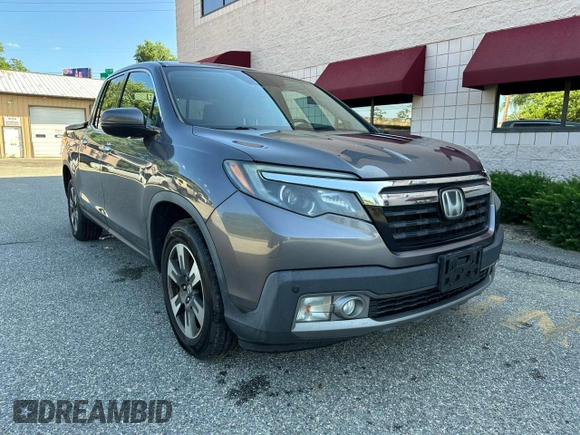 2019 Honda Ridgeline RTL-E with VIN 5FPYK3F71KB009532, listed as a Copart auction lot 65827935 with 217,177 mi miles and Clean title. Bid and sale history available at DreamBid. Image 1.