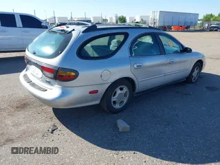 1996 Ford Taurus GL z VIN 1FALP57U9TG184497, wystawiony jako IAAI lot #42290105 z przebiegiem 149 155 mil mil oraz . Historia ofert i sprzedaży dostępna na DreamBid. Obrazek 4.