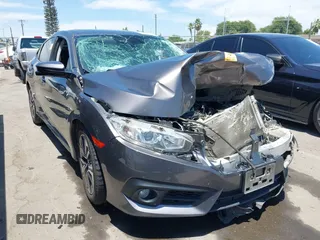2018 Honda Civic EX-T z VIN JHMFC1F36JX042382, wystawiony jako IAAI lot #42660975 z przebiegiem 184 301 mil mil oraz . Historia ofert i sprzedaży dostępna na DreamBid. Obrazek 1.