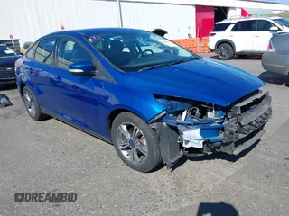 2018 Ford Focus SE z VIN 1FADP3FE4JL279265, wystawiony jako IAAI lot #42068130 z przebiegiem 43 616 mil mil oraz . Historia ofert i sprzedaży dostępna na DreamBid. Obrazek 1.