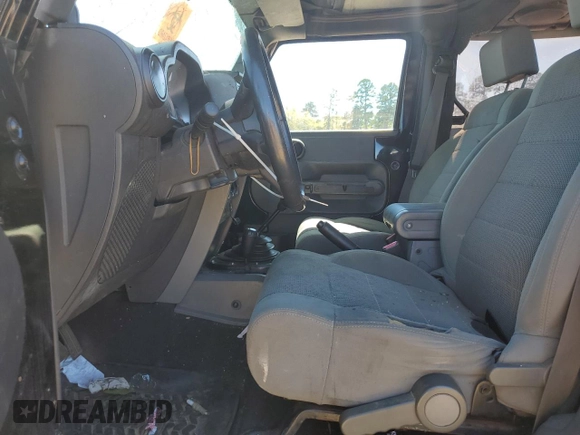 2007 Jeep Wrangler Sahara z VIN 1J4FA54177L183617, wystawiony jako Copart lot #49660785 z przebiegiem 178 846 mil mil oraz Szkoda całkowita • Salvage title. Historia ofert i sprzedaży dostępna na DreamBid. Obrazek 7.