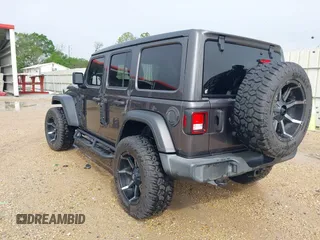 2021 Jeep Wrangler Unlimited Sport S with VIN 1C4HJXDG2MW700461, listed as a IAAI auction lot 41894307 with 82,454 mi miles. Bid and sale history available at carsss.com. Image 3.