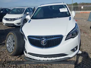 2020 Buick Envision Essence with VIN LRBFXCSA7LD014163, listed as a IAAI auction lot 41102656 with 23,277 mi miles and . Bid and sale history available at carsss.com. Image 13.