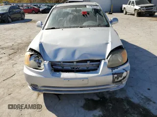 2005 Hyundai Accent GLS with VIN KMHCG45C75U638812, listed as a Copart auction lot 77968234 with 130,815 mi miles and Salvage Title. Bid and sale history available at carsss.com. Image 5.