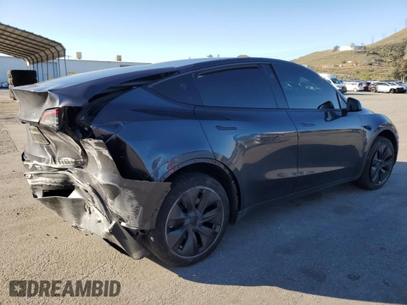 2024 Tesla Model Y with VIN 7SAYGDED7RF108604, listed as a Copart auction lot 48384825 with 24,603 mi miles and Salvage Title. Bid and sale history available at DreamBid. Image 3.