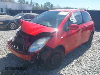 2011 Toyota Yaris with VIN JTDJT4K30B5332648, listed as a IAAI auction lot 41820350 with 216,482 mi miles. Bid and sale history available at carsss.com. Image 2.