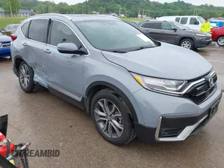 2021 Honda CR-V Touring with VIN 2HKRW2H97MH634175, listed as a IAAI auction lot 42221140 with 28,818 mi miles and . Bid and sale history available at DreamBid. Image 1.