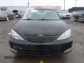 2003 Toyota Camry LE with VIN 4T1BE30K13U144114, listed as a IAAI auction lot 41829879 with 60,385 mi miles and . Bid and sale history available at DreamBid. Image 12.