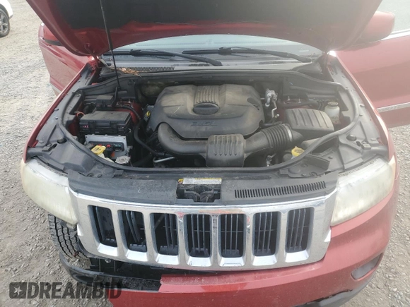 2011 Jeep Grand Cherokee Laredo with VIN 1J4RS4GG6BC704212, listed as a Copart auction lot 83753234 with 200,104 mi miles and Salvage Title. Bid and sale history available at DreamBid. Image 12.